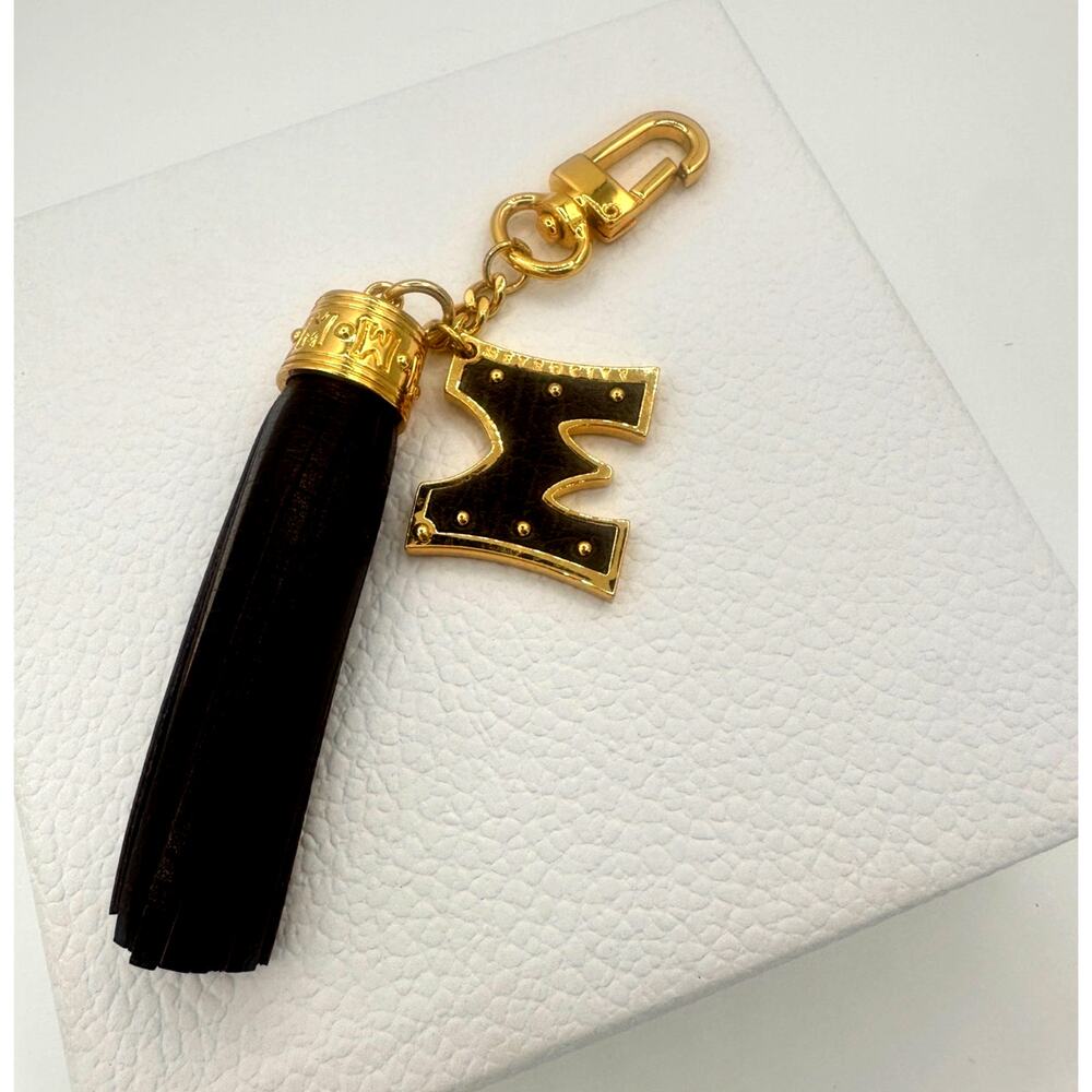 MetroCity Dark Brown Leather Tassel Bag Charm Gold Tone Logo – Brand New
